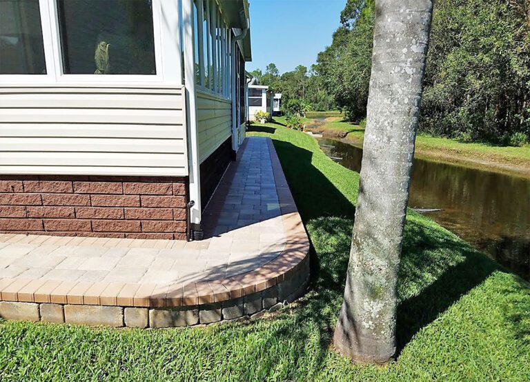 paver sidewalk around a house