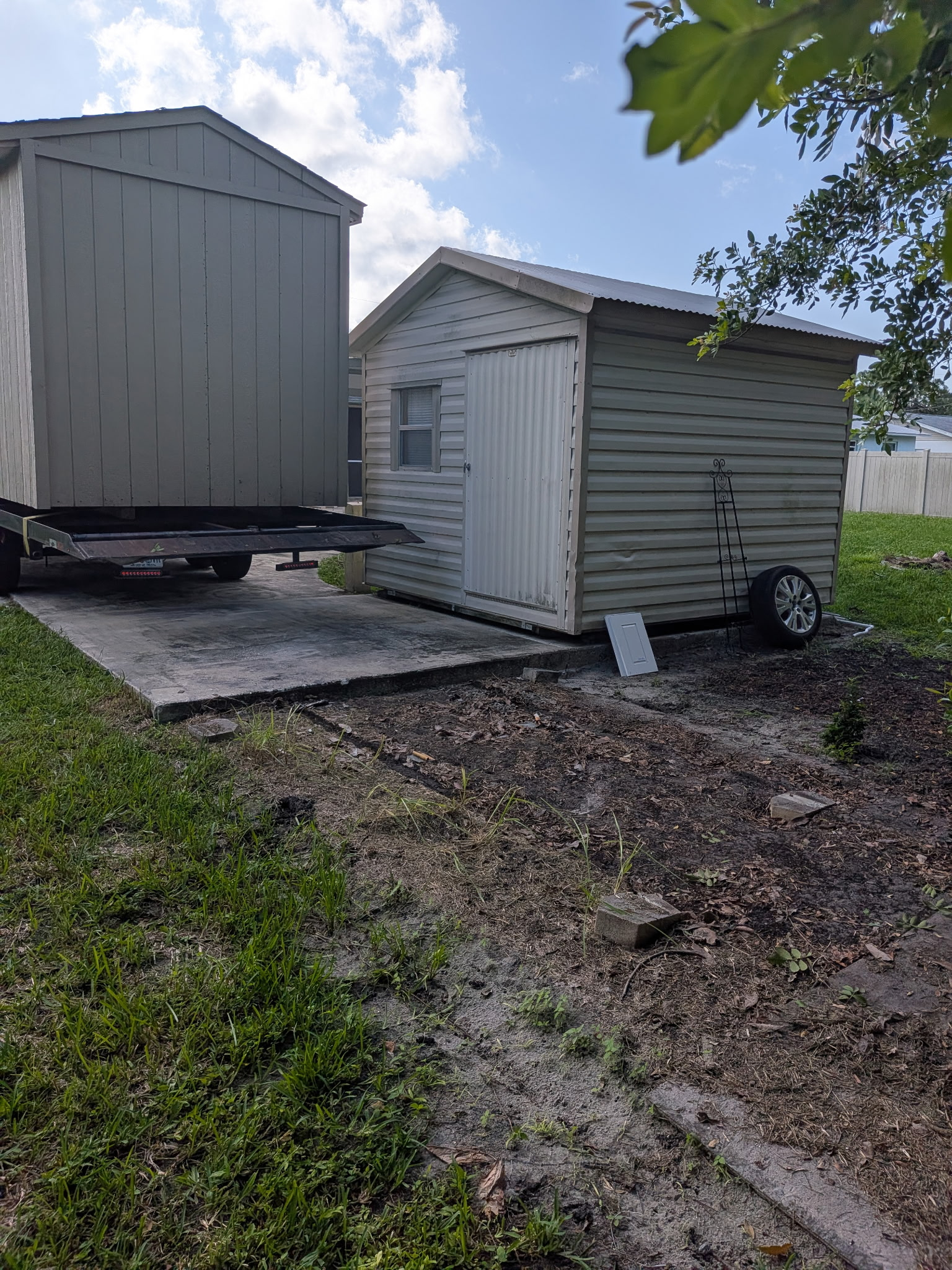 shed on trailer very close to another shed
